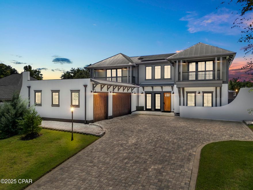 Resort luxury meets everyday living in this custom 5BR, 6.5BA home in the gated, Lake Merial Community!

Welcome to 158 Lake Merial Blvd a home of timeless elegance and modern sophistication. Perfectly positioned in the quiet, gated enclave of Lake Merial and just moments from Bozeman School (K-12), this custom-built estate offers 5 bedrooms, 6.5 baths, and an unparalleled blend of comfort, privacy, and style.
From the moment you arrive, the architectural presence is undeniable. Manicured grounds, an oversized three-car garage with epoxy flooring and custom cabinetry, and a paver drive set the tone for the detail and craftsmanship within.

Inside, the home reveals itself with wide-plank flooring, soaring 20-foot vaulted ceilings, and walls of natural light. At its heart, a chef's kitchen designed for both function and beauty — a massive 10'x6' Carrera marble island, Viking and Fisher Paykel appliances, Butler's pantry with prep sink and ice maker, and a 200+ bottle climate-controlled wine cabinet. The expansive dining and living areas easily host family gatherings or elegant entertaining.

The Owner's Suite is a sanctuary unto itself, nearly 1,000 sq ft of private luxury overlooking Lake Merial, while the spa bath features a rainfall shower with body jets, freestanding soaking tub, dual vanities, and a custom dressing room with center island and jewelry storage also having a balcony overlooking the pool. Additional 4 en-suite bedrooms provide refined comfort for family and guests alike.
The outdoor living experience is resort caliber: a heated pool with infinity-edge spa, waterfall feature, and jets, surrounded by ample patio space designed for entertaining up to 40-50 guests. A fully appointed outdoor kitchen with quartz counters, Blaze refrigerator, grill, pizza oven, and fireplace. Conveniently includes a pool house with outdoor bathroom & sauna.
No detail has been overlooked! Solar power with battery backup, EV charging station, CAT 7 wiring, fiber internet, hurricane-rated Anderson windows, copper gutters, and solid concrete construction are just a few of the countless upgrades. This is a property where luxury meets peace of mind.

A true must-see, 158 Lake Merial Blvd is more than a home. It's a statement of refined living.