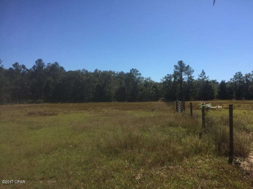 15 acres of fenced and cross fenced land with a barn and shed waiting for you to use as you see fit! Suitable for horses or cattle, or build your dream home. Call today because this will not last long!