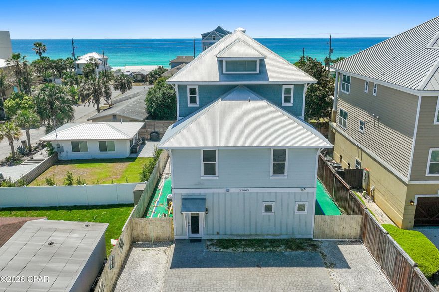 Oceanview Oasis - Luxury 6-Bedroom Retreat with Private Pool & Gulf Views in Panama City Beach.

Welcome to 22005 Belgrade Ave, a stunning single-family home perfectly positioned in the desirable Kiska Beach area of Panama City Beach, FL. This spacious 3,510 sq ft residence offers 6 bedrooms, 5 full bathrooms, and 1 half bath, comfortably sleeping up to 21 guests--ideal for large families, multi-generational vacations, or high-yield vacation rental investors. 

Step inside to discover an open-concept living area flooded with natural light, featuring a generous great room perfect for gatherings. The gourmet kitchen boasts modern appliances and ample counter space, making meal prep effortless whether you're cooking for a crowd or enjoying casual coastal dining. Multiple living spaces and three master suites provide privacy and comfort for every guest. 

Outside, unwind in your own private pool enclosed by a privacy fence--perfect for cooling off after a day at the beach. Enjoy partial gulf views from the home and easy access to the world-famous white-sand beaches of Panama City Beach. The beach is just minutes away on foot, offering convenient access to swimming, shelling, and sunset strolls.

Additional highlights include:

Built in 2016 with modern finishes throughout
Ample parking and outdoor space
Prime location near restaurants, shopping, Pier Park, 30A and area attractions
Strong rental history potential (previously generating significant income as a vacation rental)

Whether you're seeking a luxurious primary or second home, or a turnkey investment property in one of Florida's top beach destinations, Oceanview Oasis delivers unbeatable value, comfort, and coastal charm. 

Property Details:

6 Beds | 5.5 Baths | 3,510 Sq Ft
Built: 2016
Private Pool
Gulf Views
Minutes to the Beach

Don't miss your opportunity to own a piece of paradise on Belgrade Avenue. Schedule your private showing today!

This information is believed to be accurate, but without any warranty. BUYER TO VERIFY ALL DIMENSIONS, ASSESSMENTS AND ANY INFORMATION DEEMED IMPORTANT.