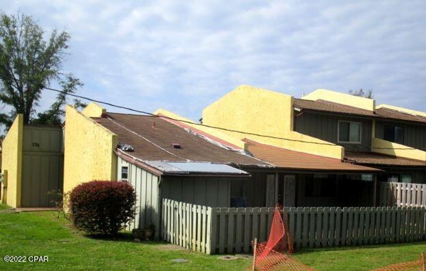 Loads of potential in this large three bedroom/two bath unit in the centrally-located community of Delwood Estate.  This unit features a kitchen, dining area, large living room with built-in bookcases and good-size bedrooms.  The back patio is fenced with plenty of area for outdoor living.  NOTE:  This unit does have extensive mold damage and will be sold in its AS IS condition.