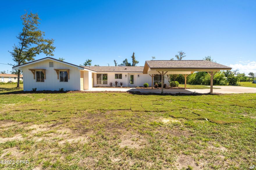 Beautiful, completely remodeled, 3 bedrooms, 2 bath home in Lynn Haven. The home has a large, 400sqft, bonus room, that could be used as a bedroom (4th). This home sits on almost an ACRE of land. Plenty of room for a pool and more. New HVAC, new water heater, and a new Culligan water system, NOT LEASED! No more water bills! New stainless-steel kitchen appliances, new granite counter tops, new shaker cabinets, new tiled backsplash, and new stainless vent hood. The home features brand new, high-quality, LVP flooring throughout. The living area features a new fireplace and vaulted ceilings.  The master bathroom features new tile flooring, new toilet, and new double vanity. The master bedroom has a large walk-in closet that accesses the laundry room. The home features large windows that allow for plenty of natural light! The entire house has new lighting fixtures and paint (inside and out.) Outside features a large pole barn style carport and the home has a large covered back porch.