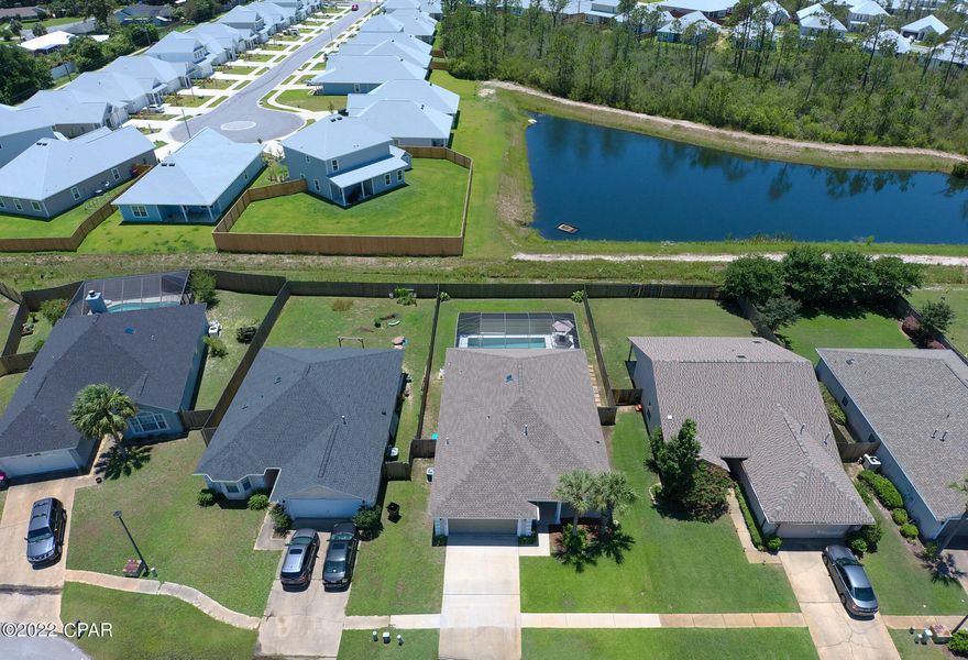 Beautiful well cared for move in ready home located close to beaches, the Navy base, Pier Park, shopping, parks, schools and fantastic restaurants.  Beautifully landscaped and freshly painted outside add to the beauty of this home. Enjoy your morning coffee or family BBQ's on your covered back porch and screened in saltwater pool. Large master bedroom with a walk in closet and view of pool and back yard. Master bathroom has a double vanity with a separate bathtub and shower. The open floor plan living room, dining room and kitchen is great for family and friend get togethers. The home is tucked away in the Magnolia Place subdivision next to a cul-de-sac with very little traffic. Newer roof and a/c with an on demand Rinnai water heater add energy saving value to this home. As a bonus the pool is scheduled to be refinished so it will be like new and the sellers are offering a one year home warranty. Privacy fenced back yard is both kid and pet friendly. One owner home has had a termite bond and renewed policy since it was built in 2004. Verify measurements if important. Call your favorite Realtor for a showing today!