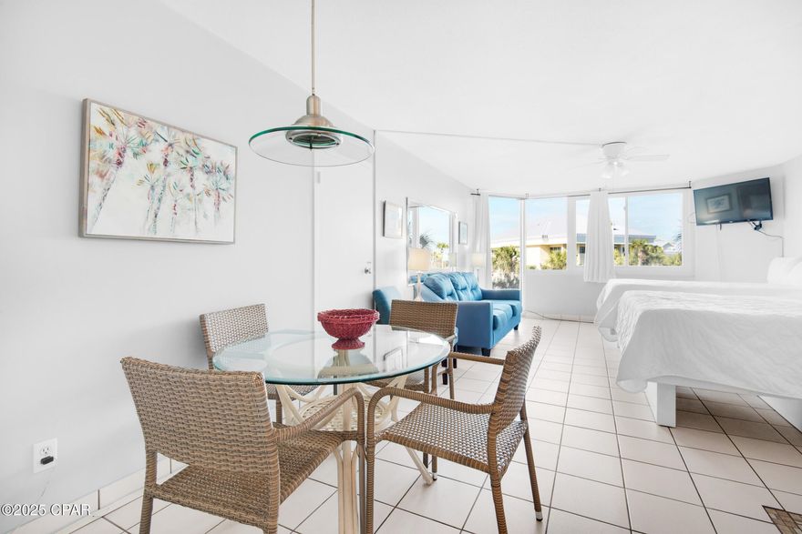 Welcome to Top of the Gulf 208, a beachfront property offering stunning views of the white sands and emerald-green waters of the Gulf of America. This fully furnished studio features floor-to-ceiling windows with beautiful views, two queen beds, a full bathroom, and an updated and open kitchen equipped with everything needed to prepare the perfect meal. Enjoy the sunset after a day of leisure from your residence, vacation home, or investment property.
Top of the Gulf offers exceptional coastal views and amenities including beach access, a large Gulf-side pool, separate kiddie pool, game room, shuffleboard court, fitness center, owners lounge, BBQ grills, picnic areas, large Adirondack chairs for relaxing, laundry facilities, and a small poolside café. The resort is centrally located in Panama City Beach, within minutes of restaurants, shopping, and various local attractions.
The HOA fee covers water, sewer, garbage, cable, and internet, ensuring a hassle-free living experience. This charming property won't last long—Schedule your showing today to make this your ideal beach retreat. All information is approximate and should be verified by the buyer if deemed important.