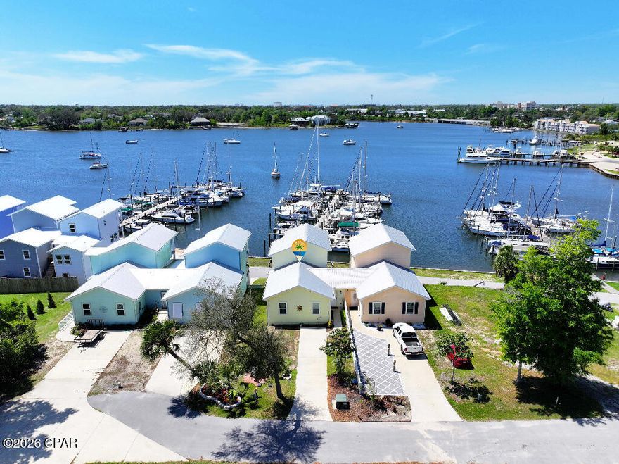 Amazing income opportunity with this waterfront Watson Bayou townhome. Mother-in-law apartment in lower level with private entrance. Can be rented separately or just additional space for yourself. Primary ensuite bedroom on top level with office nook. 2 bedrooms on main level. Balconies and water views from every level. Walk to the marina and boat launch or the neighborhood playground.