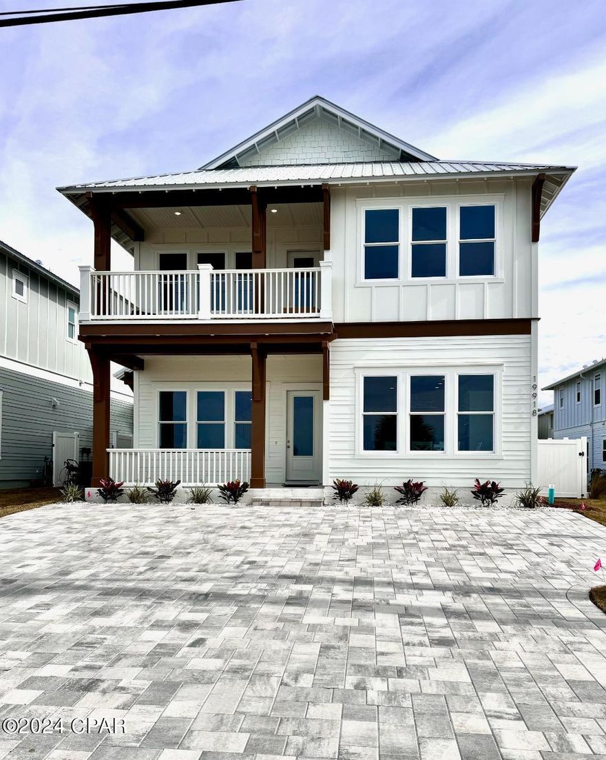 Home is now completed! PRICE REDUCED! New Construction, Fully Furnished, Coastal, Luxury Home. Located Directly on Front Beach Road, on the West End of Panama City Beach. HIGH INCOME POTENTIAL! This 6 bedroom, 4.5 bath, two story home has breathtaking views of the Gulf of Mexico from the first and second floors. The Chefs Kitchen has upgraded stainless Kitchen Aid appliance package, including a French Door refrigerator, gas cooktop, dishwasher, a wall oven/micro combination and a washer and dryer. The kitchen also boasts 42'' white Shaker cabinets with Quartz countertops and a walk-in pantry. Enjoy swimming in the large, private, salt-water pool with a gas pool heater. This stunning home also has a gas tankless water heater, hurricane impact rated windows, metal roof, Hardie siding, 8' interior and exterior doors, as well as 10' ceilings on first and second floors. There are two bedrooms on the first floor and four bedrooms on the second floor. A spacious Game room/Media room with a wet bar are overlooking the Gulf, on the second floor. Convenient location, just steps to the white sand beach and Emerald Waters of Laguna Beach and minutes from Pier Park Shopping, Dining and Entertainment. Situated a couple of blocks to the nearest grocery store, and just East of Rosemary Beach and 30A.
