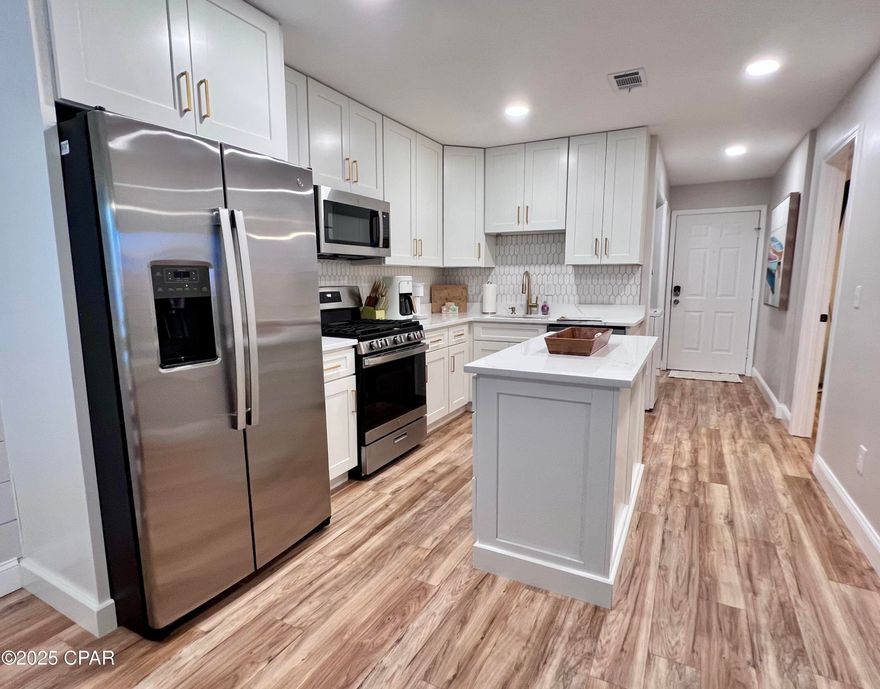 An Amazing Total Remodel that you must see. First floor One Bedroom, One Full Bath condo unit. Parking is literally steps away, no stairs to climb. This remodel is an open layout, beautiful L-shape Kitchen with an island, allowing for more useable space. All NEW Cabinets, NEW Quartz Countertops in kitchen and bathroom as well, NEW Queen Leather Sleeper Sofa with Nectar Mattress, Built in Twin Day Bed, 2 NEW Samsun TV's, NEW LVP flooring, Outside NEW Adirondack Chairs, NEW Large Storage Cabinet.  The HVAC is approx. 5 years of age, Hot Water Heater 3 years, Roof 2019, 2022 New Windows & Sliding door rated for 200 mph., Exterior painted 2021.  **This unit is completely ready to live or start earning income- Turnkey and comes Fully Furnished. Great Patio to enjoy the morning coffee.                     **Seller has an EZ Golf Cart with NEW Suspension, Batteries, Seats, and Brake Motor. The Golfcart is Negotiable and Separate from the sale of the unit.  IF Age, SF, and dimensions approximate.