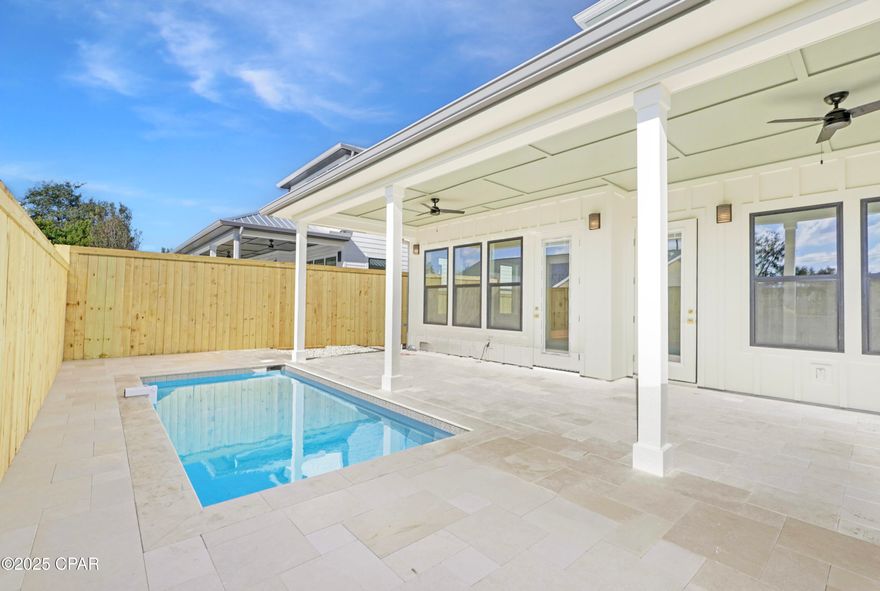 Welcome to this luxury 2025 new construction beach home just a short walk to the white sandy beaches of Panama City Beach. Designed as a primary residence, second home, or high-performing short-term rental investment, this 4-bedroom, 3.5-bath coastal retreat offers exceptional style, durability, and strong income potential. Currently configured to sleep up to 16 guests, this property is ideal for vacation rental income and large family gatherings at the beach.

The flexible floor plan features two first-floor bedrooms with private en suite baths--perfect for guests or maximizing short-term rental appeal. Interior highlights include beautiful cypress and pine accent ceilings, durable luxury vinyl plank flooring, a bright loft providing additional living or sleeping space, and a spa-inspired primary suite designed for relaxation.

The chef's kitchen features custom cabinetry, quartz countertops, and a gas stove with designer hood--perfect for entertaining after a day at the beach. Step outside to your private saltwater pool and covered patio, creating a perfect setting for outdoor living and vacation enjoyment.

Built with durable 2x6 framing and a metal roof, this home offers long-lasting quality and peace of mind. Located in a golf-cart-friendly Panama City Beach neighborhood where short-term rentals are allowed, this property is minutes from Pier Park, Scenic Highway 30A, Camp Helen State Park, TopGolf, and Dolly Parton's Pirate Voyage.

Whether you're searching for a Panama City Beach beach house, a Gulf Coast vacation home, or a high-income short-term rental property that sleeps up to 16 guests, this exceptional coastal home delivers both lifestyle and investment potential.