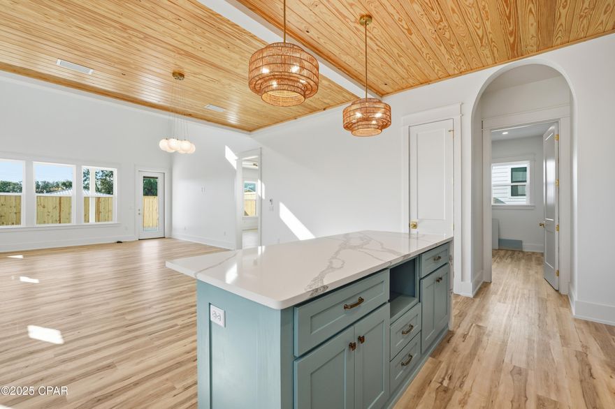 Welcome to this luxury 2025 new construction beach home just a short walk to the white sandy beaches of Panama City Beach. Designed as a primary residence, second home, or high-performing short-term rental investment, this 4-bedroom, 3.5-bath coastal retreat offers exceptional style, durability, and strong income potential. Currently configured to sleep up to 16 guests, this property is ideal for vacation rental income and large family gatherings at the beach.

The flexible floor plan features two first-floor bedrooms with private en suite baths--perfect for guests or maximizing short-term rental appeal. Interior highlights include beautiful cypress and pine accent ceilings, durable luxury vinyl plank flooring, a bright loft providing additional living or sleeping space, and a spa-inspired primary suite designed for relaxation.

The chef's kitchen features custom cabinetry, quartz countertops, and a gas stove with designer hood--perfect for entertaining after a day at the beach. Step outside to your private saltwater pool and covered patio, creating a perfect setting for outdoor living and vacation enjoyment.

Built with durable 2x6 framing and a metal roof, this home offers long-lasting quality and peace of mind. Located in a golf-cart-friendly Panama City Beach neighborhood where short-term rentals are allowed, this property is minutes from Pier Park, Scenic Highway 30A, Camp Helen State Park, TopGolf, and Dolly Parton's Pirate Voyage.

Whether you're searching for a Panama City Beach beach house, a Gulf Coast vacation home, or a high-income short-term rental property that sleeps up to 16 guests, this exceptional coastal home delivers both lifestyle and investment potential.