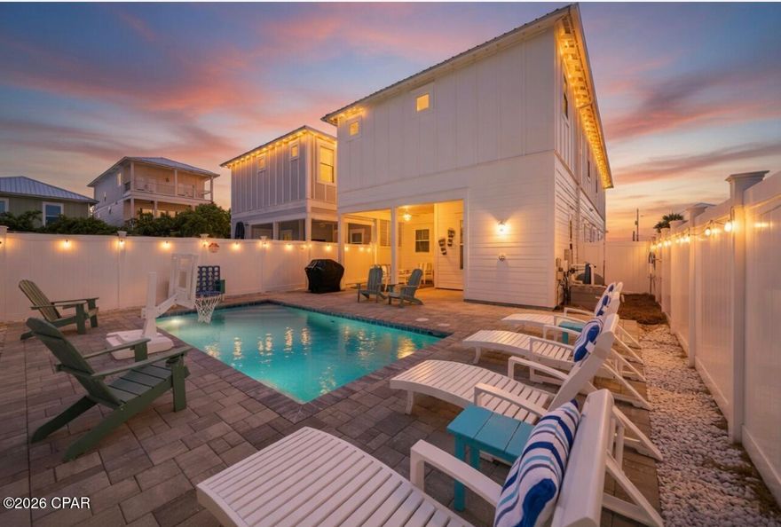 A rare combination of design, upgrades, and value--now positioned at an exceptional new price. This 5-bedroom, 4.5-bath West End beach home offers approximately 2,800 square feet of thoughtfully designed coastal living just steps from the sugar-white sands of Panama City Beach. With three spacious primary suites--one on the first floor and two upstairs--the layout is ideal for both luxury living and high-performing short-term rental use. Extensive upgrades and meticulous maintenance set this property apart, eliminating the need for post-purchase improvements. The home features full smart-home automation, including app-controlled pool pump, heater and lighting, Nest thermostats, smart door locks, outdoor lighting, sprinkler system, and even a smart refrigerator--allowing seamless remote management. The private backyard is designed for a true resort-style experience, complete with a heated pool, patio TV, app-controlled lighting, and a $10,000 premium patio furniture package with lifetime warranty. Gulf views from the second-floor balcony further enhance the coastal lifestyle. Sold fully furnished and turnkey, this property offers immediate enjoyment or income potential. Now competitively repositioned, it represents one of the best values on the West End of Front Beach Road.