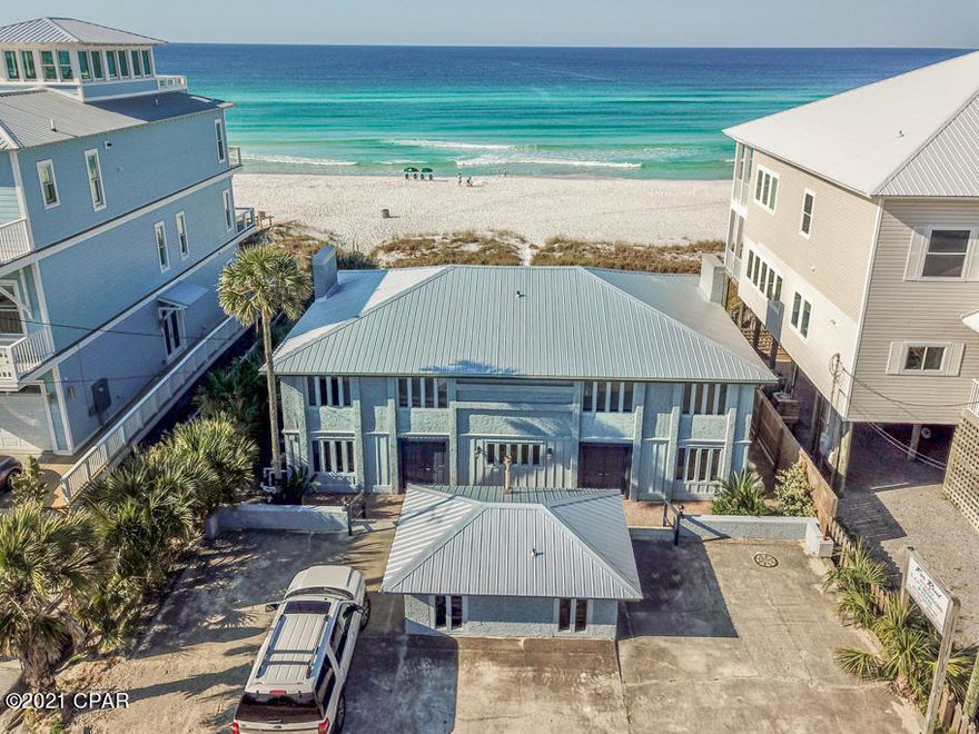 Reward yourself with this one of a kind beachfront paradise! Perfect for entertaining your family and friends in one unit while generating rental income on the adjoining unit. Located on the desirable west end of Panama City Beach, just minutes to shopping, world class dining and entertainment on scenic 30A. You can also enjoy the convenience of Pier Park, groceries and the one of a kind white sandy beaches for your backyard! Highlights include, a 16 x 38 Gulf front pool, a hurricane seawall that wraps around the home with 15 foot beams going into the ground to prevent any sand from washing underneath the home, a 45 foot balcony and the property is nestled on a 60 wide lot. New metal roof! With 7 bedrooms, 4 full size bathrooms, 2 kitchens, two lofts and more than 3,500 sq.ft this home invites comfort and the opportunity to unlock a valuable investment.

Both units are turn key and fully furnished. The high end finishes such as the exposed brick, spiral staircase, shiplap ceilings, gas burning fireplaces, interior stucco, open kitchens and the natural light that flows throughout each unit is sure to create a memorable experience for your guests and keep them returning year after year. This expansive deck overlooking the beach is perfect for large celebrations, cookouts, tanning or relaxing by the pool. Imagine waking up to the peaceful sounds of the waves crashing on the beach, spending the day relaxing with your toes in the sand and soaking up the gorgeous Florida sunsets in the evenings. You will not find another property like this on the beach. For more information or to schedule your private showing call today!