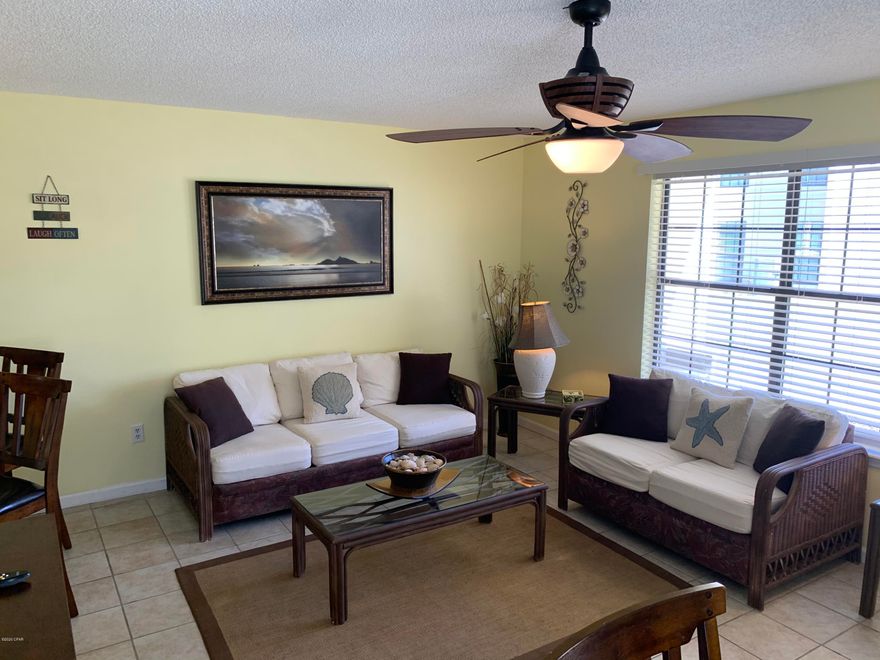 Well-maintained, pristine, never rented, highly desirable condo (sleeps six comfortably) is an end unit on ground floor with a covered porch only two buildings from pool and other resort amenities and a short walk to beach on the Gulf of Mexico. Condo is tiled throughout and fully furnished and equipped, turnkey, ready to be your second home or vacation rental--just bring your clothes, toothbrush and floaties! Horizon South is one of the most popular gated resorts on Panama City Beach for snow birds and families, located a couple miles from Pier Park restaurants, shopping and entertainment and 12 miles from the famous 30A strip in South Walton. Horizon South amenities include sidewalks, four swimming pools, dedicated beach access, basketball court, community room, horseshoe pit, shuffleboard courts as well as RV, boat and trailer parking on site (14 day maximum) and owners are allowed to have gulf carts. Popular floor plan has you entering from front door into combination living room/dining room (with expandable dining table). Down the hallway you will find the kitchen on the right, bunk bed room on the leftthen further down is master bathroom on the right, utility closet on the left and the master bedroom at the end of the hallway. Master bedroom includes a half-bath, king size bed, dresser, foot stool, television, end tables and a stack washing machine/dryer closet, clothes closet and a locking owner's closet, Living room furnishings include TV, disk player and stereo unit, love seat, queen sleeper sofa, coffee table, end tables and stools for the breakfast counter. Kitchen appliances include garbage disposal, refrigerator, dishwasher, stove/oven, coffee maker, and microwave oven. Condo is fully furnished with dishes, pots, pans, silverware, toaster, vacuum cleaner, linens, towels and equipment (see complete inventory list in listing documents) includes cooler, beach chairs and toys!  Hot water heater is only a few months old and air conditioning unit is three years old. COA fees include water & sewer, pest control, garbage dumpster/compactor, resort laundry area, mailbox area, termite treatment, grounds & landscaping maintenance, insurance for building and complex (not condo interior), cable TV, exterior and common area maintenance.