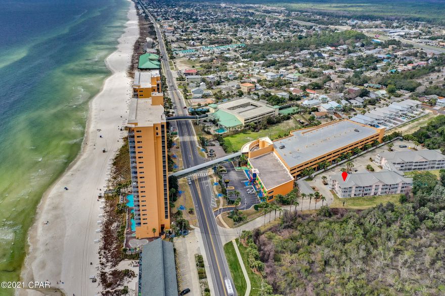 CURRENTLY UNDER CONTRACT - SELLER ACCEPTING BACK UP OFFERS! Professional photos coming soon. BEST LOCATION IN THE WHOLE COMPLEX! Tucked away in a quiet setting with whitewashed fences, lush greenery and a sparkling, refreshing pool, Peachtree Place II is a low-rise complex with an elevator and a favorite of those who are in love with the West End and all it has to offer. Located across the street from Beach Access 73, Splash condos, Beach Access 74 (with showers to rinse off the beach sand) and just a few miles from Pier Park. This immaculate, spacious, top floor condo, has a wraparound balcony with a gulf view. You can even hear the waves crashing on the beach. Ease of access is also a non issue with one of the stairwells located right outside the front door of this wonderful 2 bedroom, 2 bath condominium. Verify measurements if important