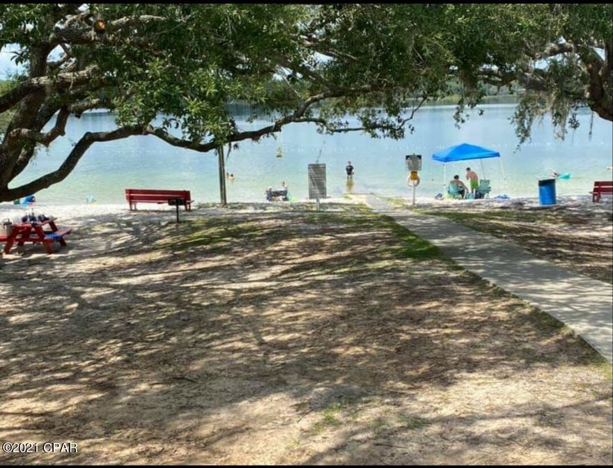 This just over a quarter acre lot is only just over 1300 ft. away from the beautiful Boat Lake Swim Park (see photos). It is located within the popular Sunny Hills Community which has a golf course and recreational park as well. The area is also home to numerous other spring fed lakes. It is less than a hour drive from Panama City Beach. The visual depiction of the property lines on photos are not exact.