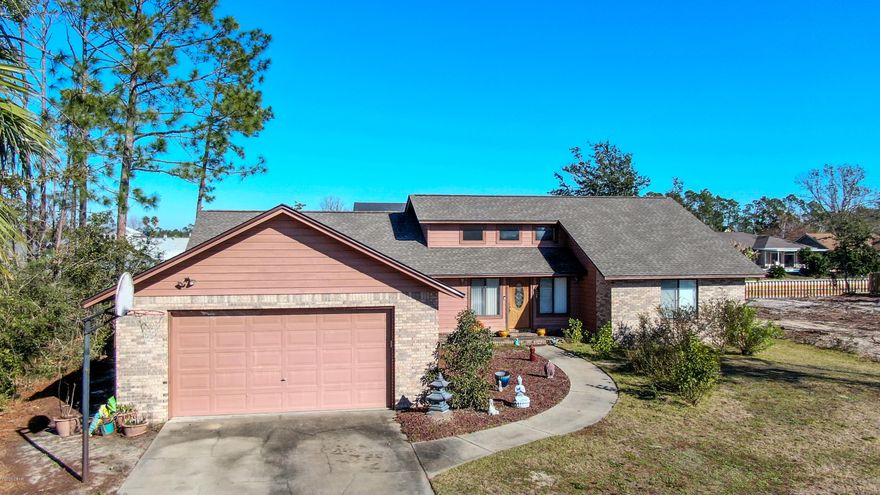 EXCEPTIONALLY WELL-MAINTAINED WATERFRONT HOME IN LYNN HAVEN!  This home features a spacious living room with wood-looking tile throughout.  The kitchen has loads of cabinets, a breakfast bar, new stove, sink and is open to the formal dining room. The Master bedroom is over 30-feet in length and can handle the largest of furniture, and you will appreciate the walk-in closet and large Master bath with a double vanity.  This split-bedroom home has all good-sized additional bedrooms and bath.   Additional features include a glassed Florida room along the back of the home that overlooks the in-ground pool and a, two-deck wooden platform with a screened room that is perfect for entertaining.  With underground utilities, this is one of the most desirable neighborhoods in Lynn Haven!  Don't miss