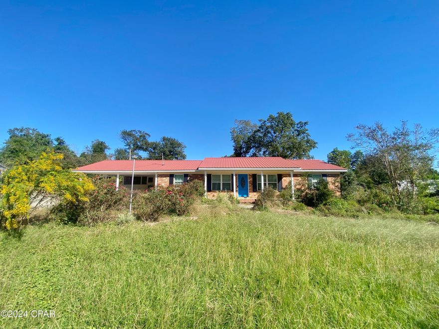 This 3-bedroom, 2-bathroom brick ranch is brimming with opportunity. Nestled on a corner lot, the home offers a spacious 2-car carport, a large screened porch perfect for relaxing, and a covered back patio ideal for outdoor entertaining. The standout feature is the expansive outdoor workshop, with one side partially finished, complete with electrical, paneled walls, and a window unit—perfect for a home gym, office, or hobby space. The other side provides ample storage, including a lean-to for even more convenience.

Inside, you'll find two inviting living spaces, a dedicated dining room, and a large eat-in kitchen boasting solid surface counters and plenty of cabinet space. While the home is in need of updates, it's the perfect canvas to customize and build equity with your personal touch.

Important Details:

AS IS sale with recent home inspection available.
Cash or conventional renovation buyers only.
Take advantage of this opportunity to turn this home into a true gem!