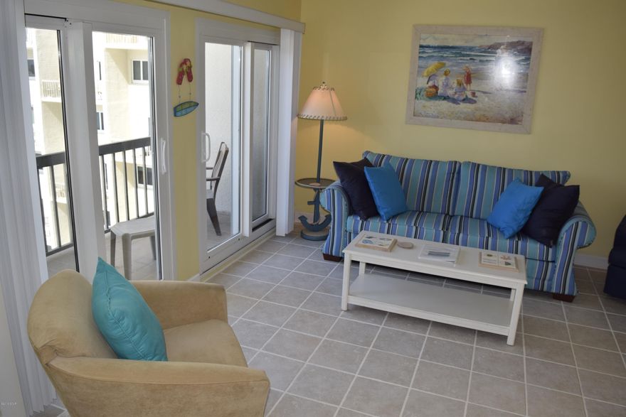 What a fun and colorful 2 bedroom unit at Pinnacle Port Resort with two balconies and double Gulf views!  Pinnacle Port Resort is a quiet little gem at the West End of Panama City, bounded on the South by the beautiful Gulf of Mexico and on the North by Lake Powell, one of the State’s largest coastal dune lakes.   It is situated on a 25 acre site between a pristine State Park--Camp Helen—and the quaint beach homes of Carillon Beach.    A townhouse-style unit (2 levels) featuring living/dining room, kitchen (remodeled with quartz counter tops), half-bath, laundry and Gulf-front balcony on the main floor and a guest bedroom and bath on the second floor, as well as a master suite with its own private balcony overlooking the Village of Carillon Beach and its coastline.  The unit is fully furnished for all your needs, including Wi-Fi and flat-screen TVs.  
Pinnacle Port amenities include two poolsâ€”one is an indoor/outdoor pool; four lighted tennis courts, shuffleboard, basketball, picnic areas, playground, grills, saunas, a Gulf-front pool deck, boat and fishing docks and boat ramp on Lake Powell, fishing in both salt-water and fresh water, and don't forget the uncrowded beautiful sparkling white sandy beaches that run the full length of the resort.   
All heating, air conditioning and hot water, along with the usual items covered by Association fees, are included in the quarterly fees.  Owners pay a small electric bill for lighting and appliances only.