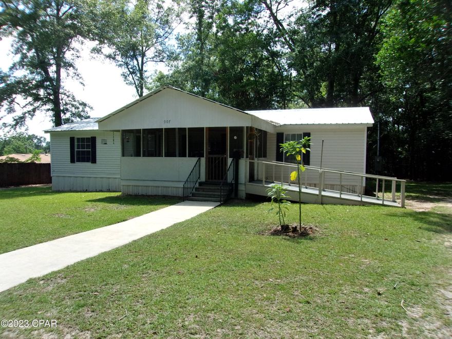 ''
Currently under contract, Seller will consider backup offers''.  Bring your clothes and move on in with this 3 Bedroom 2 Bathroom 2006 Doublewide mobile home sitting on almost half acre in the city limits of small rural town. Spacious living room opens to dining room and nice country kitchen. Large master bedroom with walk-in closet. Master bath has garden tub and walk-in shower. Other 2 bedrooms have walk-in closets.   A small Florida Room has been added off the dining room. Large screened front porch. Handicapped ramp leading to the front porch. Concrete walkways and concrete driveway to the back where you will find a 2 car detached carport and a nice size metal storage shed. Nicely landscaped yards with a large concrete waterfall in the front yard. Survey available. All existing furnishings stay. Conveniently located to shopping and churches. Only 45 minutes away from Panama City Beach with the worlds most beautiful beaches. Check it out today!!!! Won't be available for long.