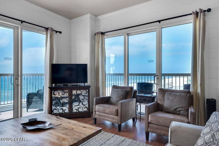 This Gulf-front corner unit at Sunrise Beach Resort offers a rare opportunity to enjoy breathtaking west-facing sunset views from a wraparound balcony--one of the most desirable positions in the building. Ideally situated on the 5th-floor amenity level, the unit provides quick and easy access to the pool and spa. Even better, you can skip the elevator entirely by parking on the 4th floor and taking just one flight of stairs directly to your door.

 

This spacious 3-bedroom, 3-bath residence features sweeping Gulf views from the living room, kitchen, dedicated dining area, and primary bedroom. Ten-foot ceilings--higher than many units in the building--enhance the open, airy feel throughout.

 

The thoughtfully designed layout includes a Gulf-front primary suite with direct balcony access, dual closets, and an ensuite bath. A guest bedroom with a private bath and a second guest room large enough to accommodate both a full-size bed and bunk beds make this unit ideal for hosting family and guests. A formal foyer creates a welcoming entry, while custom built-ins and crown molding throughout add warmth and character rarely found in typical condominiums.

 

Additional features include a separate laundry room with an interior owner's closet, generous living spaces, and a layout that lives more like a home than a condo--perfect for extended stays or full-time living.

The seller has made significant upgrades to enhance comfort and functionality, including a commercial-grade Speed Queen washer and dryer (with 8-year warranty), updated HVAC heat pump, new king mattress in the primary suite, LG refrigerator, GE stove, dishwasher, and an added beverage refrigerator. A new water heater is also being installed. The Gulf-front balcony is outfitted with durable Polywood outdoor furniture designed to withstand coastal conditions.

 

Sunrise Beach Resort offers covered Gulf-side parking with convenient access--no need to cross the street--and major building improvements have already been completed. Located within walking distance to restaurants, coffee shops, convenience stores, and beach supply shops, this property combines lifestyle, convenience, and strong rental potential.

Whether you're searching for a profitable investment or a relaxing coastal retreat, this exceptional unit at Sunrise Beach delivers the best of both.