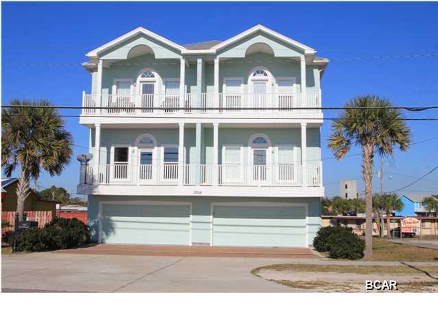 Incredible opportunity to own a piece of paradise one row back from the beach with amazing gulf views! This spacious second floor single-story unit at Vista Del Mar, with convenient access by elevator, offers incredible gulf and sunset views with easy beach access. Beautiful kitchen with wood cabinets, stainless steel appliances, and granite countertops highlight the inviting open floor plan in the living/dining/kitchen area. Step out onto your private balcony to enjoy spectacular gulf and sunset views. Parking is a breeze in the massive 40' deep 2.5 car garage with easy access to your unit from the elevator. This Vista Del Mar unit offers easy living with it's spacious floor plan and large master bedroom with walk-in closet and luxurious master bath featuring tile floors,