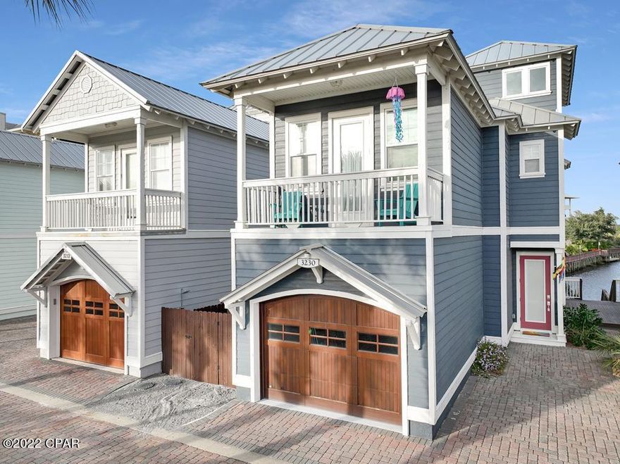 STUNNING 4BD/2.5BA CANAL FRONT TOWNHOME W/GULF VIEWS AT WATERSIDE VILLAGE IN MEXICO BEACH! High ceilings w/picture window views of the canal add to the appeal of the spacious living, kitchen & dining area. Renovated top to bottom, the space is nicely appointed w/quartz tops, SS appliances & breakfast bar seating. Upstairs this level is a gulf side BR w/private terrace, guest BR & full BA. Winding up to the 3rd level is a tranquil space for a 4th BR or office w/more amazing views of the canal & Gulf of Mexico. Just steps to white sand beaches of the emerald coastline, Waterside Village amenities include a heated pool, lighted boardwalk & boat cleats for day docking. Looking for an investment? Short term rentals are allowed! Take the 3D tour & call today!