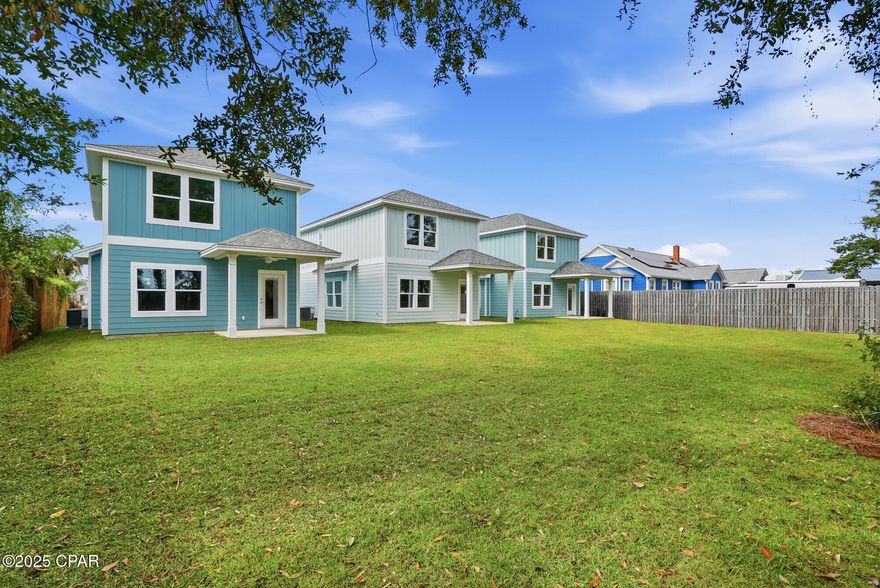 Modern new construction just blocks from downtown Panama City, offering style, comfort, and room to grow. This two-story home features Impact rated exterior doors and windows, cement board siding with board and batten accents, 3 bedrooms, 2.5 baths, 1,582 square feet, and a 1-car garage. All bedrooms are upstairs for privacy and spacious living.

Inside, you'll find beautiful White Oak luxury vinyl plank flooring throughout the main level, paired with real White Oak stair rail accents for a warm, modern touch. The kitchen stands out with quartz countertops, custom cabinets, brushed gold pulls, fixtures, and light pendants, plus stainless steel appliances. Bathrooms feature tile flooring and designer finishes, including a master suite with double vanity, walk-in shower, and tray ceiling.

A versatile mini mudroom sits off the garage next to the half bath, perfect for dropping shoes, keys, or bags after coming in. It also connects to the main hall from the front entry for easy access. Additional features include a pantry and a spacious under-stair storage closet.

Built for comfort, the home includes 2x6 exterior walls, insulation between floors for sound reduction, high ceilings on the main level, and carpet in the upstairs bedrooms. An irrigation system is already in place.

Zoned MU-3, this deep 33' x 150' lot with alley access gives you the option to add an accessory dwelling unit (ADU). Great for rental income, a guest house, or future flexibility. Buyer to verify requirements.

A fresh, thoughtfully designed home close to everything downtown has to offer. Don't miss out!