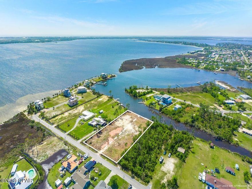 Bring offers - let's talk! This .75 acre waterfront paradise has been absolutely transformed. It previously had a large, abandoned home with a pool and pool house that all needed demolition. All of that has been completed, debris removed, fill dirt brought in, overgrown brush cleared, land surveyed, lots split, and now it's a blank canvas ready for your dream home! Located on Emmons Bayou at East Bay, this lot has over 100' of water frontage and would be perfect for a dock. Bring your boat, kayaks, Sea-Doo, etc. Great for fishing. You need to come see this location! Sweeping panoramic views; catch both the sunrise over East Bay and the sunset over the bayou! This is Lot 13 (Lot 14 is currently pending under contract). No HOA here and very few cars passing on this dead-end street. The surrounding area includes the gated East Bay Preserve and Yacht Club plus several million+ dollar homes with more being added. Very convenient location that's less than 10 minutes from Tyndall AFB, community parks, lots of restaurants, and shopping. Plus it's an easy drive to Mexico Beach or Panama City Beach. Excellent investment opportunity - come take a look today!