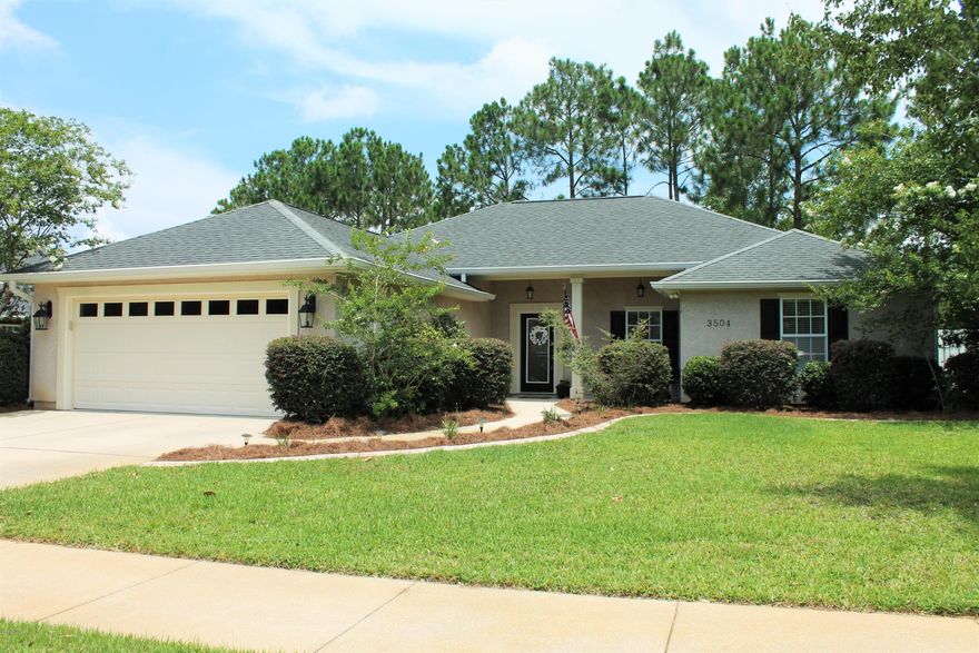 Lovely custom built home in the well desired Hammocks Subdivision, from entering the neighborhood to the front door of this home you will feel WELCOME! This 3 bedroom, 2 bath home has so many upgrades! The Greatroom features a gas fireplace with a custom mantel, beautiful brand new installed wood style tiles, built in cabinets, recessed lighting, crown molding and tray ceilings. The kitchen is immaculate and features custom stained cabinets, corian countertops, stainless steel appliances, a breakfast bar with breakfast area and tile flooring that flows into the formal dining room. The dining room is also appealing to the eye featuring lovely trim work including wainscoting, crown molding and a beautiful chandelier. The Master Suite is split from other bedrooms. The master bedroom  features upgraded plush carpeting with a double step up ceiling! The master bath features a whirl pool tub with a separate shower, double vanities and a large walk in closet! The two additional bedrooms are both large in size with great closet space. The guest bath features a custom stained cabinet with a granite counter top.  The outside is a retreat in itself as well with a screened in back porch, extra large concrete back patio great for grilling out and additional seating, privacy fence, sprinkler system on a lawn pump and a large 2 car garage. Neighborhood amenities include pool and pavilion, lovely landscaped entry and common areas, sidewalks and much more! See pictures. Don't wait to see this one...it won't last long!   All sizes and measurements are approximate please verify if important.