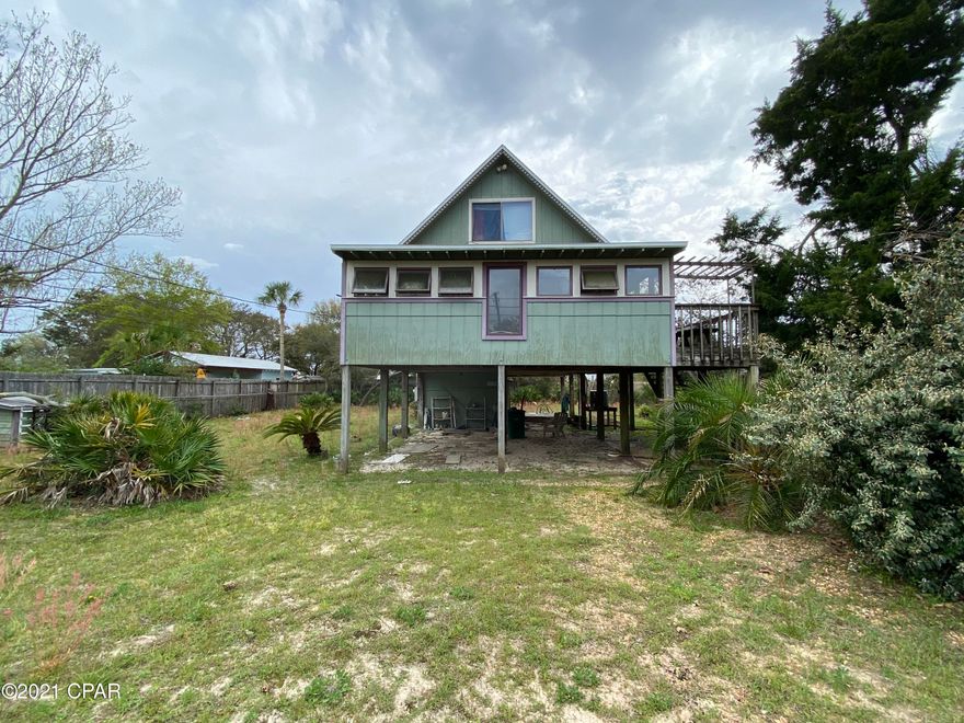 Great opportunity to buy high demand West End Beach House on a large 82x150 lot.  This 3 bedroom is a diamond in the rough.  Located 2 miles from 30a and only a block away from Lake Powell.  The street is comprised of  new construction and well kept homes.  Ride your bikes to the beach, lake powell, 30a, and Camp Helen State Park.  Has views of Powell from front porch and upstairs bedroom.  Home does need work and a great time to make it your own.  Lowest price house on the West End.