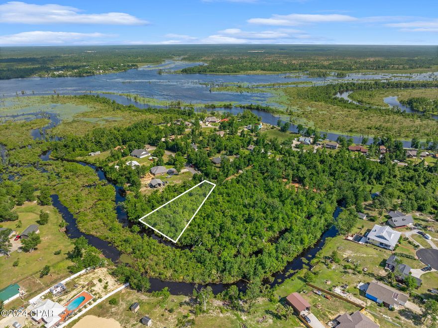 Spectacular waterfront lot opportunity on approximately .60 acres near Deer Point Lake and Econfina Creek. Build your dream home on this spacious and private lot located at the end of a cul-de-sac.  This is the perfect location for the outdoor enthusiast and there are two nearby boat ramps for additional lake access at Bay Head North Boat Ramp and Cherokee Landing. 

This property has direct access to Deer Point Lake from the canal located towards the back of the lot.  Deer Point Lake spans over 5,000 acres and is a popular fishing and recreational destination for those who wish to fish for Shellcracker, Bream, and Largemouth Bass.  The Lake offers other recreational activities such as wakeboarding, tubing and water skiing during those hot summer months. 

This lot is also located close to Econfina Creek.  Econfina Creek which encompasses numerous beautiful springs and ends at Deer Point Lake, is a popular destination for those wishing to enjoy kayaking, canoeing, fishing, camping, hiking, and horseback riding.   The Creek expands through three counties, Bay, Washington, and Jackson, and is known for its vast vegetation and forest canopies.  

Better yet, there is NO HOA or restrictive covenants!