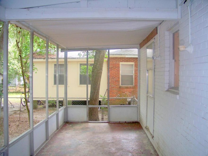 A must see investment opportunity located in the heart of historical St. Andrews. This charming property is within walking distance of Oakland Terrace Park, Lake Caroline and St. Andrews Marina. Just a short drive away, you will find the Bay County Library and Bay County Government Center, as well as shopping and dining and entertainment. This home is a two bedroom one bath solid all brick home, with a huge screened back porch that looks over the shady completely fenced back yard. The sizeable front porch is covered, and as you enter the home into a generous living room to the left you will find a separate dining area and wonderful kitchen with ample cabinet and counterpace. The bedrooms are good sized and share a generous bathroom. There is a large screened porch in the rear of the home