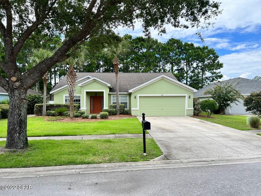 Great location for this Palmetto Trace home! Across the street from Pier Park, next door to Frank Brown, and just minutes to the beach. This home is a 4 bedroom 2 bath split bedroom floor plan with vaulted ceilings in the formal living and den areas. This home also has a 2 car garage with a covered back patio. All new exterior and interior paint with new carpet. Palmetto Trace features 2 community pools, side walks, street lamps and dog walking areas.