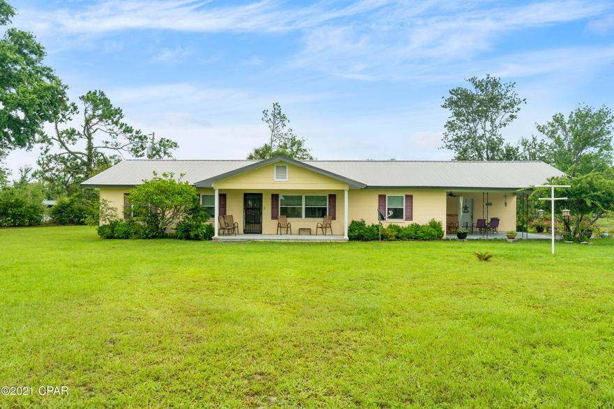If you are looking for an extraordinary home with a plethora of land, you are in the RIGHT place!! 3.3 ACRES!! Brand NEW Well replaced in 2019! Detached 3 Car Garage with plenty of space for a workshop. NEW Roof replaced after Hurricane Michael. This Stunning Home is a 3 bed, 2 bathroom with an extra Office space! Brand New LVP Flooring. New Carpets installed after storm in each room! Cherokee Landing and Deerpoint Lake is only a 15 minute drive. Deanne Bozeman School and Lynn Haven are also within a short driving distance. Located on the back side of the property is protected lands of the water management district which means.... Wildlife Viewing!

Schedule your showing today with your favorite realtor!