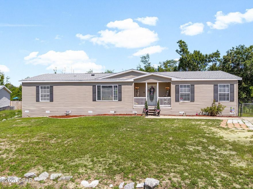 CURRENTLY UNDER CONTRACT, SELLER WILL CONSIDER BACKUP OFFERS. Welcome to 3716 Haley Way, an updated and beautifully maintained manufactured home situated on a generous 0.413-acre lot in the heart of Panama City. Conveniently located just off Alva Thomas Road and only minutes from Transmitter Road, this property offers easy access to schools, shopping, dining, Lynn Haven, and Tyndall Air Force Base. Inside, you'll find new flooring throughout and a spacious layout designed for comfortable living. The kitchen features ample countertop space, a walk-in pantry, and a breakfast bar—perfect for both everyday use and entertaining. The expansive primary suite measures 17x14 and includes a large walk-in closet and a stunning ensuite bath with a soaking tub, separate shower, and dual vanities. The living room includes a fireplace and opens through sliding glass doors to a covered back porch overlooking the fully fenced backyard. Recent updates include a roof replaced in 2019, a water heater installed in 2018, many new light fixtures, new ceiling fans in all rooms except the living room, all new blinds throughout, and the septic system has been recently pumped. This move-in ready home offers comfort, modern touches, and a convenient location that's hard to beat.