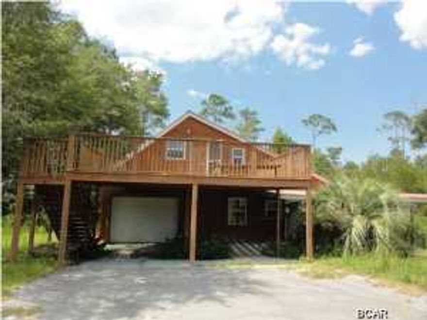 Unique home on almost 5 acres of land! Huge deck off second story efficiency apartment! Efficiency apartment has kitchen and full bath! Beautiful hardwoods on main level with pine paneling throughout! Large master retreat with trey ceilings! Kitchen boasts stained cabinets with tons of storage! Deep garage! Don't miss out on this great opportunity! Show and submit your offer today!