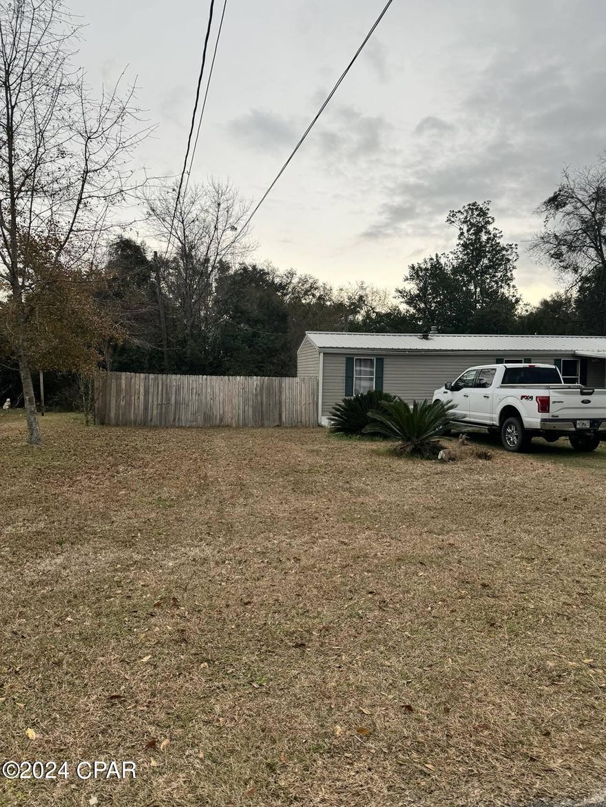This 2 bedroom, 1 bath single wide mobile home is located just outside of Blountstown city limits. Situated on just over a quarter of an acre, this modest home is priced to sell and under $100K. The property features a gated back yard with an outbuilding behind the mobile home. Conveniently located, it provides easy access to town. Don't miss out on this opportunity!