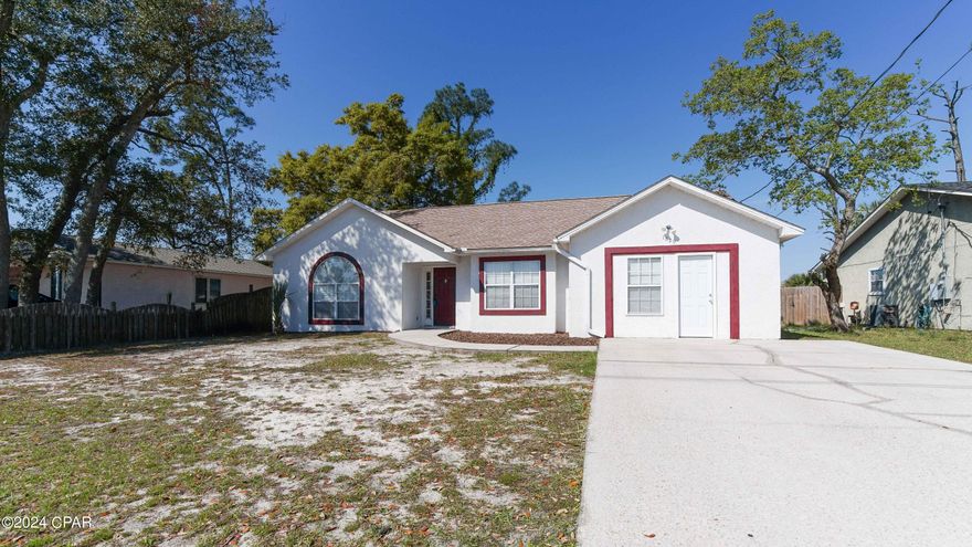 UNDER CONTRACT- SELLER ACCEPTING BACKUPS. Seller is motivated and has GOT TO GO! A new life and new job, in a new city await this sweet family, leaving you the opportunity to own this well appointed 3BR/2BA home in St. Andrews! Upon entering, you can immediately see this house has been well loved and cared for- and you will feel right at home. The vibe of this home is unmatched- you must see in person to experience it! Living/dining room has cathedral ceilings. Walls are painted throughout with rich, earthy jewel tones. Beautiful cherry wood cabinets and stunning forest green quartz countertops line the eat in kitchen. Stainless steel appliances and cherry wood pantry as well. Beautiful hardwood floors throughout with crown molding. Kitchen has 18 inch ceramic tile floors and the rest of the common areas of the home has beautiful cherry colored hardwood. Garage has been converted into a Rec room but could easily be converted back into a 1 car garage if you like. Large privacy fenced backyard, and a sizeable storage building for all your tools and equipment. On the back of the home there is a 12x18 bohemian-styled screened in patio for the family to grill out or just sit in and enjoy the afternoon! All the heavy lifting has already been done for you- Roof was installed in 2018, HVAC was installed in 2019. Septic is freshly pumped as of January. NO FLOOD INSURANCE IS REQUIRED, AND THIS HOME HAS NEVER FLOODED! The exterior of the home, driveway, and sidewalk have been freshly bleached and pressure washed, fresh accent trim paint, and a brand new exterior door installed on the bonus room! Home is located in a super tight-knit community just down from Lucille Moore Elementary School- and the City of Panama City is currently in the process of creating a Greenspace/Park area right in the neighborhood! The only thing missing from this home is YOU!  Call your favorite Realtor and set up a showing  appointment today- you'll be so glad you did.  **Measurements are approximate, not exact- must be verified by the buyer if important.**