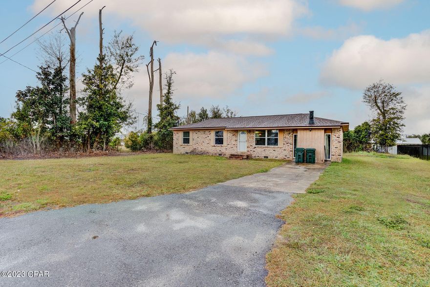 CURRENTLY UNDER CONTRACT, SELLER WILL CONSIDER BACKUP OFFERS $30k Price improvement!!!  Lynn Haven is hot! This three-bedroom/one-bathroom awesome ranch home is waiting for your family!! The optics are here with a yard spacious enough to stretch out in and a neighborhood dotted with new construction; a rebirth post-hurricane Michael.  Look closely and you will see the Sellers have a bright new coat of paint throughout the interior and new vinyl flooring that complements the open floorplan.  Beautiful new vinyl-clad windows installed in 2022.  The finished garage sports a wood burning fireplace and terrific extra room akin to a family room. Energy-smart, added insulation in both the attic and under the floor!  Clean & crisp count! Shed does not convey.  Call or text for a showing now!