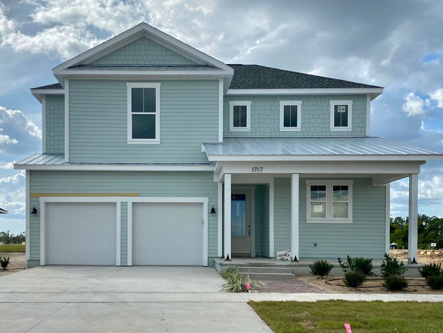 St. Vincent plan with Boat Builder Exterior built by Samuel Taylor Homes.