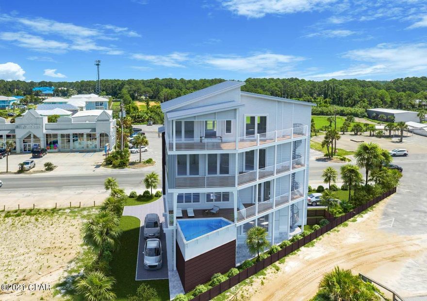 Welcome to The Party House! A brand new beach home like no other from the Holiday Beach Development Team. This beach front home will feature 6 bedrooms and 6 1/2  baths, over 3,900 square feet, elevator, recreational room and loft for both the kids and adults to enjoy. Elevated pool on the second floor so you and your guests can enjoy the beach and views of the Gulf of Mexico right from the pool deck. This home is right next to the county pier, centrally located on PCB and within walking distance to several popular attractions and restaurants. Will sleep up to 21 guests and slated for a late December completion. With all 6 bedrooms facing the gulf and a VIP view to the annual Sand Jam Music Festival this home will truly be one of kind!