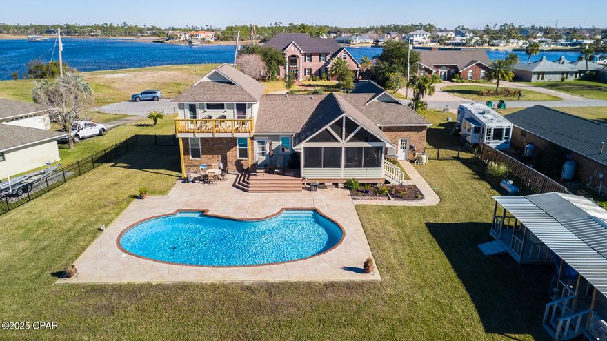 Currently under contract- sellers will consider back up offers. Experience the epitome of waterfront living at this spectacular 3 bedroom(with plenty of flex space), 3.5-bathroom home on North Bay with direct Gulf access. Boasting breathtaking panoramic water views and a private boat lift and dock, this property is a rare find for nature lovers and water sports enthusiasts alike. The horseshoe-shaped pool creates a tranquil outdoor oasis, perfect for relaxation or entertaining guests. Inside, the versatile bonus room offers endless possibilities as a teen retreat, craft space, music room, game room, or home office. The gourmet kitchen features custom red oak cabinets and an open-concept design that is both elegant and functional. The main floor primary suite is spacious and convenient, with ample storage space to keep things organized. With a two-car garage and sheds, there is plenty of room for all your tools, pool floats, and more.

Located in a prime area with excellent schools, shopping, dining, healthcare facilities, and the beach all within easy reach, this home offers the perfect blend of luxury and convenience. Plus, with a brand new septic tank, you can enjoy peace of mind knowing that this property is in top condition. Don't miss out on the opportunity to own this incredible waterfront retreat and start living your dream coastal lifestyle today. Schedule a showing to experience all that this home has to offer!