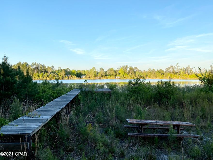 CURRENTLY UNDER CONTRACT, SELLER ACCEPTING BACKUP OFFERS 

Over an acre waterfront lot in The Highlands of Compass Lake with a newer dock and an old mobile home.There is roughly 125' water frontage on a beautiful lake. Here you can enjoy lakeside living and the slower pace of life.  The mobile home is is need of repairs making this a cash sale only. Most of the value here is in the land and two wells and septic! It would be a great property to build your dream lakefront home or use the existing mobile home for a fish camp. This is a beautiful piece of property and with a lot of clean up it can be restored to its former glory.