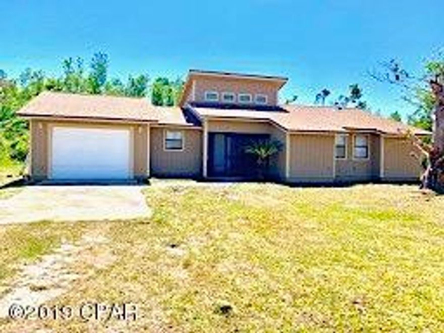 Beautiful remodeled 3 bedroom, 2 bath,  home on 1.7 acre lot, only 15 minutes from PC Mall and 23rd St.  This home has been professionally remodeled, post hurricane to include new roof, new siding, floors, counters, lighting, doors, paint, some windows.  The ceilings are high and there are french doors that lead to exterior patio.  A babbling brook flows along the rear of the property.  Lot includes the North (Left) side lot with shed.  Home is conveniently located near deerpoint lake and boat launch, with lots of room to park your toys or add a pool.  (All info is approximate and buyer to verify any info that is important. Offers are responded to within 24-48 hours. To be sold As Is, No Seller Repairs)