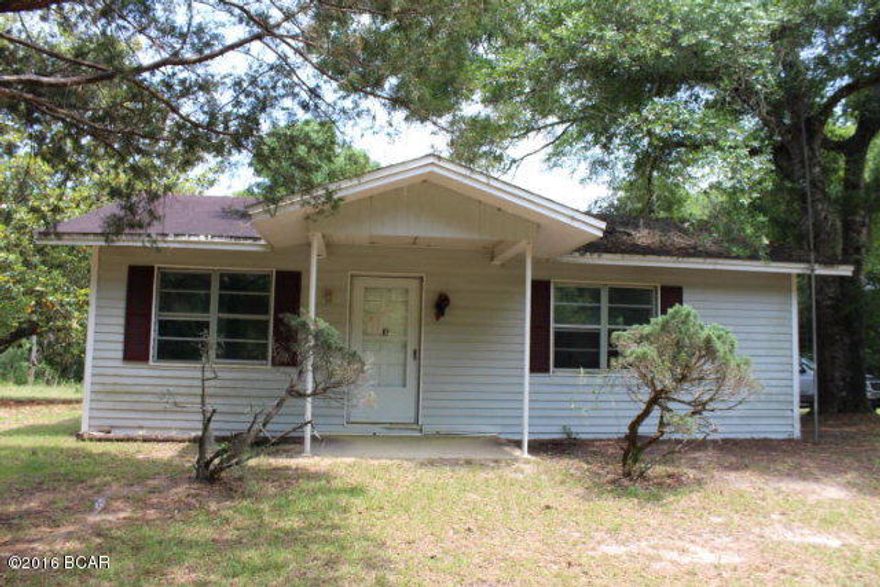 PRICE REDUCED!! This cutie is just waiting for loving hands! She has great potential to shine! The house sits on 1.53 acres not far off paved road and not far to several lakes in the area and to a golf course. You have lots of room here for gardening and it would make a great place to retire to. There is a large eat-in kitchen, 3 bedrooms and a large utility room.