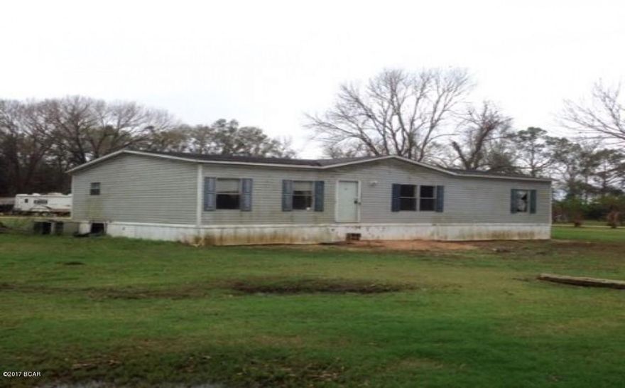 3/2 mobile home on an acre lot.