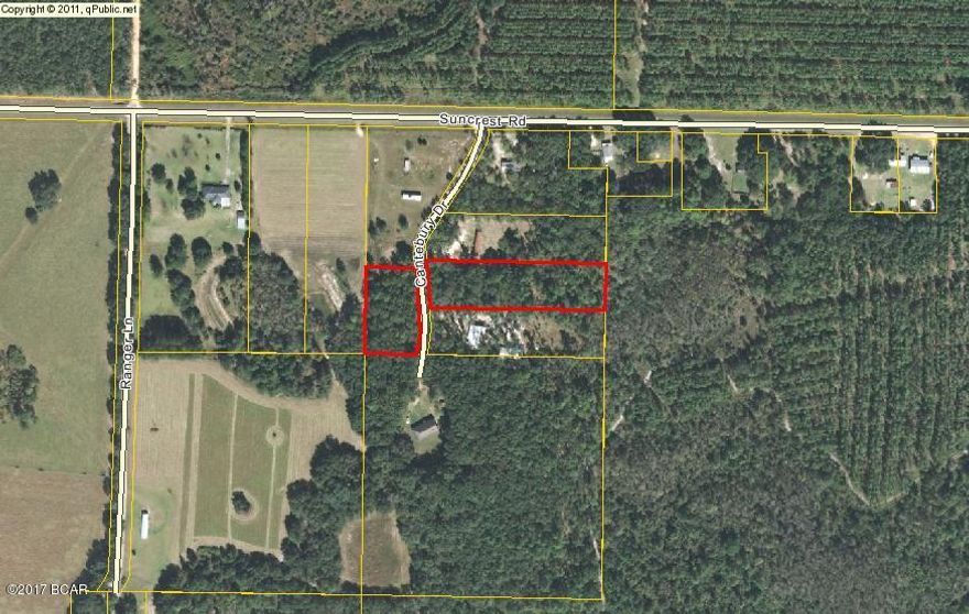 This property would make a great home place.  It is a 2.45 acre parcel that is divided by the road.  There is approximately 1 acre on one side for $7500.00 and 1.45 acres on the other side of Cantebury for $7500.00. Buy one side or the other or just buy them both. This is just a short distance to Walmart yet country living at its best.

Must see!!!