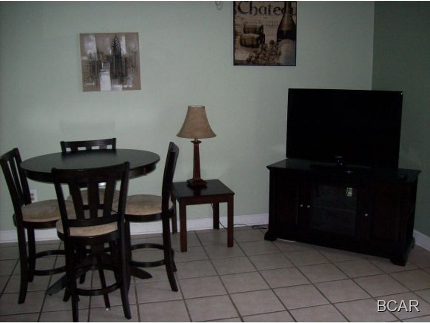 Very nice 3rd floor walk-up unit with a great view of Grand Lagoon. Unit is fully furnished and the open loft acts as the second bedroom. Enjoy the evenings on the large balcony overlooking the water, pool and clubhouse.