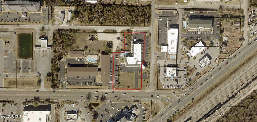 Superb location on 23rd street with high traffic count and visibility.  Property is located right before I Hopp on the left and corner of Mercedes Street, and in front of 'Days Inn Suites'.   Seller is interested in splitting/dividing this parcel in front of the Hotel as he has no need for it.  Land is high and dry and ready to build for office building, oil change  and numerous other possibilities. Lots and commercial land is scarce on 23rd Street.  This section is waiting for you to build out.  Land section measurements are approximately and should be verified by Buyer or Agent.