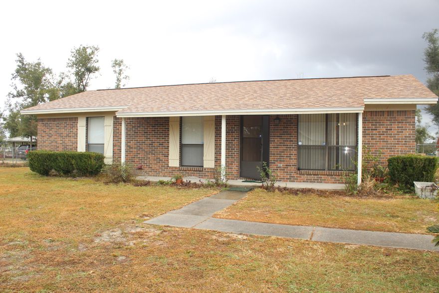 Looking for country living with over a half acre lot, featuring an all brick home, 3 bedrooms, 1 1/2 baths located in the Bear Creek area.  Interior of home needs some sheetrock repairs as a result of the storm.  Inside laundry room.  Open living and dining area.  New roof on home, detached garage and outbuilding in 2019.  The detached garage is 24' X 26' with power and a 10' X 12' storage building.  You will enjoy the yard with 2 pecan trees, a pear tree, muscadine vines and a eucalyptus tree.  Great starter home.