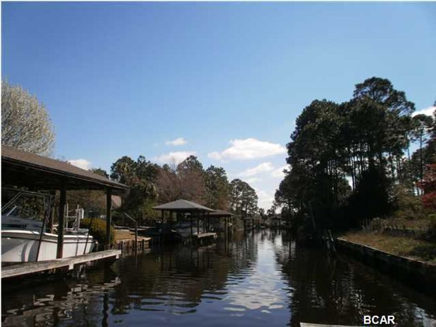 Waterfront building lot in established Northshore subdivision. Raised lot with fill, partially cleared,with 100 feet of canal waterfront. Canal leads directly into Upper Goose Bayou and North Bay and is deep enough to accommodate boats, kayaks and jet skis. Beachcomber Drive is a cul de sac street conveniently located to Lynn Haven's stores, parks, churches, and movie theaters, and just about 10-15 minutes to Panama City Beach.