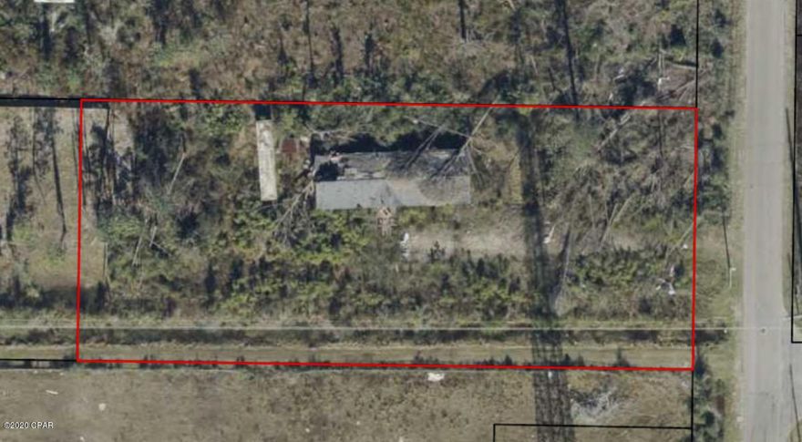 One acre lot for sale.  Great location just off of Wewa Hwy and N Tyndall Pkwy. easy access to everything! There is a tear down mobile home on site, please do not enter.